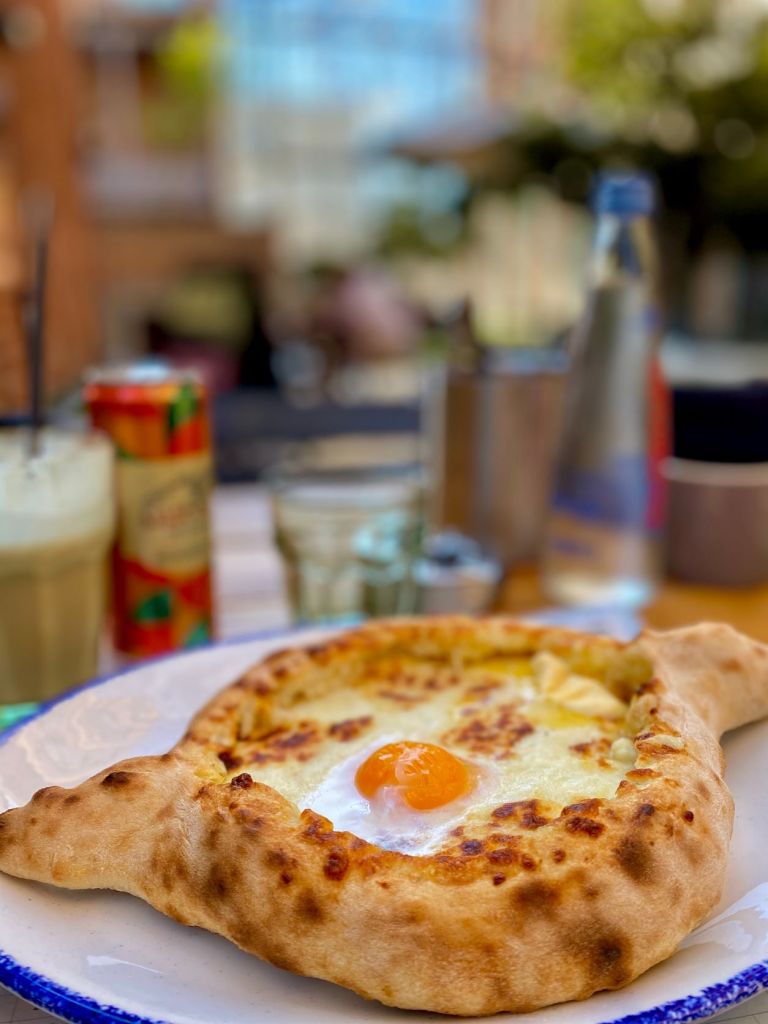 Georgian cuisine is absolutely delicious, and khachapuri is one of my favorites. Bread, cheese, butter, and eggs make it so fattening but so good.