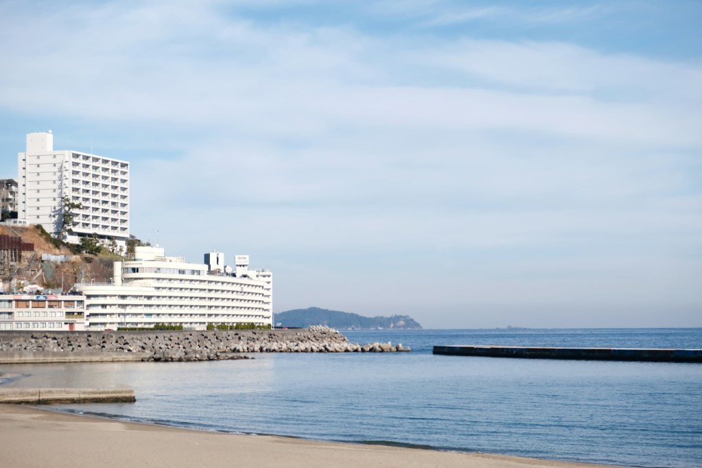 Atami Sun Beach is a popular spot on the Izu Peninsula thanks to its calm waves and white, sandy shores.
